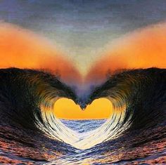 a heart shaped wave in the ocean with an orange and blue sky behind it,