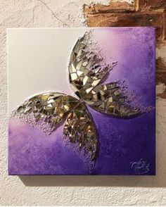 a purple and white painting on a wall with gold leaf shapes in the middle,