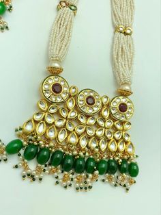 At enayah's our goal is to create designs that fit best to our customer's taste.  This beaded necklace set is carefully designed to your taste.  It is available in two beautiful color options.   This set is a showstopper!! Traditional Beaded Bridal Set For Wedding, Kundan Bridal Necklace With Hand Set Round Beads, Traditional Beaded Wedding Sets, Traditional White Bridal Necklace Hand Set, Kundan Necklace With Round Beads For Wedding, Wedding Kundan Beaded Temple Necklace, Wedding Beaded Necklaces With Stone Work For Diwali, Wedding Kundan Necklace With Round Beads, Traditional Bridal Necklace With Hand-set Round Beads