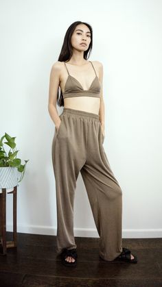 Your vacation is booked and these pants are definitely going. Relaxed pants you can dress up or down. Luxurious to the touch. Olive pants with elastic waistband and pockets. This viscose is buttery soft and has a slight stretch. Designed to fit with a relaxed, straight fit through leg. Perfect for staying chic on the weekends. Pairs well with the matching bralette. Product Details: - 28" inseam - Elastic waistband - Pockets Composition & Care: - Material: 95% Viscose, 5% Spandex - Machine Wash c Olive Pants, Relax Pants, Guinea Bissau, Top Sales, Two Piece Sets, Mozambique, British Indian, Brunei, Elastic Band