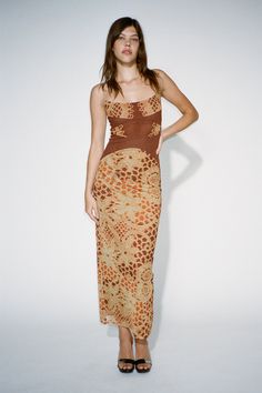 Our Gia Dress in Lace Orange is a mesh-lined maxi dress with sultry mesh side slits, made to accentuate your body in all the right places. She is here to turn heads. Slip her on (or off) as you please... Designed for a tight fit, true to size. Please refer to the flat-lay image for product accuracy. Copper Wedding Guest Dress, Fitted Mesh Maxi Dress For Summer, Sheer Mesh Bodycon Maxi Dress, Sheer Bodycon Mesh Maxi Dress, Fitted Maxi Length Mesh Dress, Fitted Mesh Maxi Dress, Brown Maxi Dress With Side Slits, Fall Orange Dress, Corset Back Dress