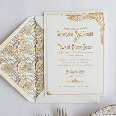 wedding stationery and place setting with silverware