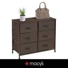 a brown dresser with drawers and a handbag on top