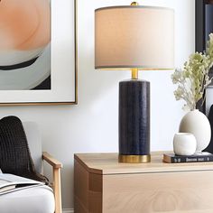 a living room scene with focus on the table lamp and side table in the foreground