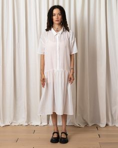 Slightly sheer oversized button-down dress with collar and drop waist full skirt in great viscose fabric. CONTENT & CARE:68% Viscose, 32% NylonHang wash cold, Lay flat to dry MEASUREMENTS (laying flat):XS/S - Chest: 25”, Length (Shoulder to hem): 43”, Bottom Width: 48”M/L - Chest: 26”, Length (Shoulder to hem): 44”, Bottom Width: 49" Flowy Smock Midi Dress For Daywear, Relaxed Fit Smock Dress For Daywear, Flowy Short Sleeve Shirt Dress, Flowy Short Sleeve Shirt Dress For Daywear, Daywear Smock Midi Dress, Oversized Short Sleeve Dress For Daywear, Oversized Short Sleeve Shirt Dress For Daywear, Loose Fit Short Sleeve Shirt Dress For Day, Collared Maxi Dress For Summer Daywear