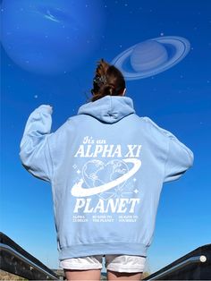 a woman wearing a blue hoodie with the words, it's a dppie planet on it