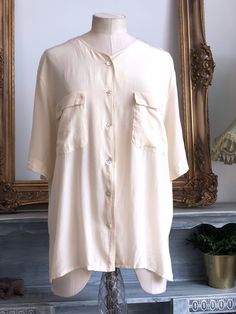 Chest (pit to pit ) 57cm Length 66cm Cream silk vintage blouse vintage condition - very good Summer Beige Silk Blouse, Beige Silk Blouse For Summer, Classic Cream Button-up Blouse, Beige Silk Blouse For Daywear, Cream Short Sleeve Workwear Shirt, Classic Beige Blouse For Summer, Classic Beige Blouse For Daywear, Elegant Beige Short Sleeve Shirt, Vintage Solid Summer Blouse