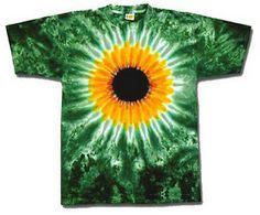 a green and yellow tie - dye shirt with a black hole in the center