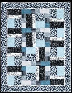 a blue and black quilt with squares on it