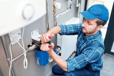 a plumber working on an electrical box