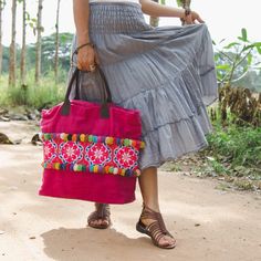 "The beautiful & unique tote bag with adorable colorful pom poms is made with an amazing piece of fabric woven by the HMONG hill tribes of Lanna Region (Northern Thailand). Easy to carry with strong leather strap, a zipper enclosure and inside pocket. We buy materials from Hmong market and we design and sew by hand. Some of the bags we modify to improve the product. The Hmong tribes live in the North of Thailand and have origins from the Tibetan area of China. N.B. YOU MAY NOT RECEIVE THE EX Pink Bohemian Bag For Daily Use, Pink Bohemian Crochet Shoulder Bag, Bohemian Canvas Bag For Daily Use, Bohemian Handwoven Pouch Beach Bag, Pink Handwoven Bags For Festival, Traditional Pink Tote Bag, Bohemian Pink Hobo Bag For Travel, Bohemian Pink Tote Beach Bag, Pink Bohemian Crochet Bag For Everyday Use