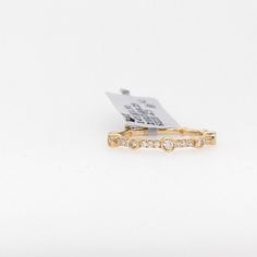 This simple durable band is perfect for wearing by itself or stacking with other rings or bands! The occasions to show off this band are endless - mother's day, graduation, wedding, birthday, date night, Christmas, etc. :) 14k Gold Bands With Diamond Accents, Stackable Cubic Zirconia Open Band Rings, Everyday Diamond Stackable Bands, Cubic Zirconia Open Band Stackable Rings, Stackable Cubic Zirconia Fine Jewelry Bands, Gold Cubic Zirconia Eternity Band With Bezel Setting, Fine Jewelry Stackable Rings With Bezel Setting, Fine Jewelry 14k Gold Bands With Single Cut Diamonds, 14k Gold Bands With Single Cut Diamonds