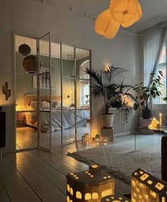 a living room filled with lots of furniture and lights