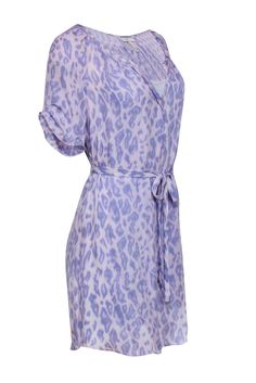 Go soft and safari chic with this Joie frock! The classic shirtdress is upgraded with a luxe leopard print in a lovely lilac hue. Perfect for rocking some fierce vibes wherever you go! Roar into brunch and beyond in style when you pair this belted beauty with strappy sandals and a cute little baguette. Size S No fabric content available, most likely silk Front button-up closure Built-in slip Shirt-style silhouette Notch neckline Short sleeve All-over leopard print Matching tie belt Bust 32" Wais Purple V-neck Mini Dress For Spring, Purple Button-up Spring Dress, Purple Animal Print, Purple V-neck Ruffled Mini Dress, Purple Leopard Print, Safari Chic, Leopard Print Shorts, Classic Shirt Dress, Shirtdress