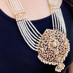 Featuring a modern pearl rani haar that speaks of magnificence and splendidness. Made in 22ct gold, this piece shows the exquisite craftsmanship. With the intricate designs and high-class materials, this Rani haar is sure to leave a lasting impression on any occasion. The haar weighs 142.82 GMs including 73.81 GMs of hanging and stringing beads. The earrings 23.09 GMs including 2.61 GMs of hanging beads. This product has been purity assayed by BIS and the unique 6 digit HUID assigned to the thre Bengali Gold Jewellery, Pearl Rani Haar, Seed Pearl Jewelry, Gold Jewellery Set, 22k Gold Jewelry Necklaces, Stringing Beads, Indian Reception, Pearl Long Necklace, Rani Haar