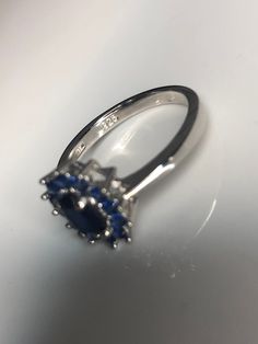 On Promo Sale! It is Stunning Sterling Silver 925 Ring with central 1.89CT natural Diffused Sapphire. The sapphire is Natural, not Created!! We also have matching earrings. Please look in the Earrings section:) Sapphire size 5*7 mm Side Stones are Blue CZ Will come in a Gift Box I'll be happy to answer any questions:) Pink Pouch, Princess Cut Rings, Heart Shaped Rings, Man Made Diamonds, 925 Ring, Natural Blue Sapphire, Multi Stone Ring, Natural Sapphire, Favorite Rings