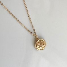 The Rose - A timeless symbol of love and beauty! This handcrafted Rose Pendant Necklace is a lovely piece for special occasion or everyday!  Whether worn alone or layered, it's the perfect gift for ladies of all ages - Moms, friends, sisters, or the bridal party. :: DETAILS :: ♥ Rose pendant is handcrafted of 14K Gold fill, 14K Rose Gold fill, or Sterling Silver; it measures approximately 1/2" in diameter. The length of the pendant is 3/4" including bail.  Each pendant will vary slightly due to Rose Flower Pendant Necklace For Wedding, Elegant Rose Flower Necklace For Gift, Delicate Rose Necklace With Roses Detail, Rose Detail Jewelry For Wedding, Rose Gold Flower Necklace As Gift, Rose Gold Flower Necklace As A Gift, Rose Gold Flower Necklace With Rose Design, Rose Flower Jewelry For Bridesmaid Gift, Adjustable Jewelry With Roses For Gifts