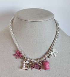 You are bidding on an adorable Betsey Johnson Pink BabyCakes Mixer Sugar Bows Faux Pearls Baking Necklace that is new with tags. Perfect for the baker in your life!  Make her dazzle! Necklace is 16" with a 2" extender.  The charms measure .5" up to .75" in length. See my other auctions for this same necklace sold in a 2-pc set with the bracelet and more Betsey Johnson Jewelry. Check out my other auctions for Handbags, Clothes, Shoes, Jewelry, Scarves, Accessories, Ornaments and collectibles. All items come from a smoke and pet free home. Grandma Maximalism, Funky Jewelry Necklaces, Betsy Johnson Aesthetic, Dopamine Jewelry, Clothe Reference, Dollette Core, Pink Clothing, Betsey Johnson Purses, Pet Jewelry