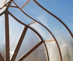 a close up view of the inside of a metal structure with wood and glass panels