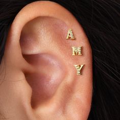 the ear has three letters that spell out'a, m, y'on it