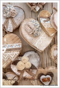 several heart shaped cookies with bows and laces on the top one is decorated in brown and white