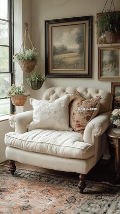 a living room filled with lots of furniture and pictures on the wall next to a window