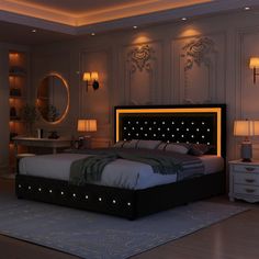 a bedroom with a large bed and two lamps on either side of the headboard