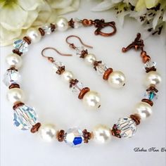 This handmade bracelet & earring set is made with Cream Crystallized Pearls, Crystal Bicones and Round Faceted Beads both glistening with an A/B finish that reflects the copper components-just gorgeous, you'll also find copper accents with Tierracast Antique Copper components, Copper Round Beads, Antique Copper Toggle and Ear Wires. This is a one of a kind item. The bracelet measures 7.75 inches. The earrings measure 1.75" Wonderful for the Rustic/Country Bride, Gift. Elegant Copper Bead Jewelry, Elegant Copper Jewelry With Round Beads, Elegant Copper Beaded Jewelry, Elegant Beaded Copper Jewelry, Country Wedding Jewelry, Crystal Bridal Jewelry Sets, Groom Fashion, Country Bride, Formal Jewelry