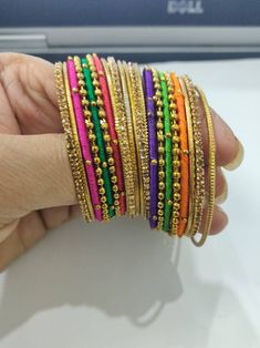 Welcome to our shop We bring to you very ethnic products from core of India almost every thing is handmade or custom made Set of 22 Bangles in multiple colors Size 2.4 We will be happy to serve you Festive Handmade Yellow Bracelets, Handmade Pink Festive Bracelets, Handmade Pink Bracelets For Festive Occasions, Handmade Pink Bracelets For Festive Season, Handmade Pink Bangle For Festive Occasions, Festive Handmade Pink Bangle, Multicolor Bangle For Festive Occasions, Festive Multicolor Bangle Jewelry, Pink Handmade Bracelet For Diwali