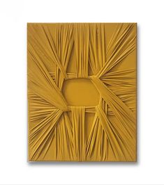 an abstract piece of art made out of yellow paper