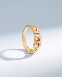 Embrace timeless romance and modern artistry with the La Fantaisie Half Band. This exquisite piece is a symphony of light, featuring an array of baguette and princess-cut white diamonds, each chosen for their radiance and clarity. Details 18k yellow gold, rose gold or white gold 0.97 carats of baguette, princess and round white diamonds 5.5mm width Ref: BAR1054D Elegant Cluster Ring With Baguette Diamonds In Round Cut, Elegant Baguette Diamond Cluster Ring, Elegant Cluster Baguette Diamond Ring, Elegant Cluster Diamond Ring With Baguette Diamonds, Elegant Cluster Ring With Baguette Diamonds, Elegant Gold Cluster Ring With Half Eternity, Elegant Gold Cluster Ring With Baguette Diamonds, Elegant Cluster Ring With Baguette Diamonds For Promise, Elegant Yellow Gold Diamond Ring With Baguette Diamonds