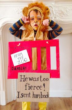 a child dressed as a lion holding a sign that says, from the zoo he was too fierce i sent him bad