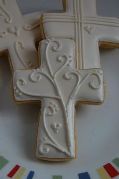 the decorated cookies are ready to be eaten on the platter for guests to eat