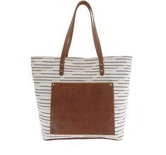 This trendy textile tote features a rich, full grain leather trim, plus leather bottom and straps for long-lasting wear. The spacious interior provides two zippers and accessory pockets, while a distinctive exterior leather pocket separates Shelby from your everyday totes, and keeps your phone and keys more readily at hand.
Handcrafted in the U.S.A. (15.00"W, 12.00"H, 6.00"D) On-the-go Satchel Bag With Leather Trim, On-the-go Bucket Bag With Leather Handles, Brown Coated Canvas Bucket Bag With Leather Handles, Everyday Canvas Shoulder Bag With Leather Lining, Chic Leather Bucket Bag With Canvas Lining, Coated Canvas Shoulder Bag With Leather Handles, Top Handle Coated Canvas Bag With Leather Handles, Chic Coated Canvas Bag For On-the-go, Everyday Use Canvas Shoulder Bag With Leather Lining