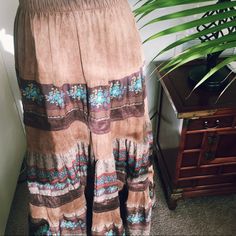 Unique Maxi Skirt Great For Fall. Plain Brown And Plain Dark Brown Layers Are Composed With Swede Like Material. Elastic Banding On The Waist So It Stretches. It Doesn't Have The Size Labeled, But I Would Recommend This To People Who Wear M And Probably To L Because Of The Elastic Band (Have The Waist Measurement Picture). Never Worn. In Excellent Condition. Material : Cotton 65% Polyester 35% Brown Full-length Skirt For Spring, Spring Full Length Brown Skirt, Brown Full Length Skirt For Spring, Bohemian Ankle-length Lined Skirt, Bohemian Full Length Lined Skirt, Brown Full-length Maxi Skirt, Bohemian Full Length Skirt For Spring, Brown Bohemian Maxi Skirt For Vacation, Vintage Tiered Skirt Bottoms For Festival