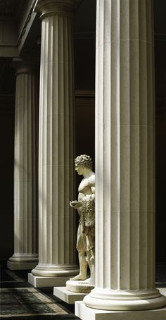 an image of a statue in the middle of columns