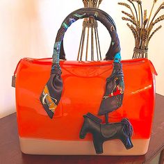 100% Authentic Furla Candy Jelly Hand Bag, Large Bag Approximately (L X W X H): 12 X 7 X 8 Inches Brand New Without Tags, No Dust Bag. Twilly And Charm Included! Elegant Multicolor Bags For On-the-go, Orange Top Handle Shoulder Bag With Dust Bag, Orange Top Handle Bag With Dust Bag, Luxury Orange Bags With Top Carry Handle, Luxury Orange Bags With Large Capacity, Chic Orange Top Handle Satchel, Luxury Orange Handheld Bag, Luxury Handheld Orange Bag, Luxury Large Capacity Orange Bags