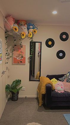 a living room filled with furniture and lots of flowers on the wall above it's mirror