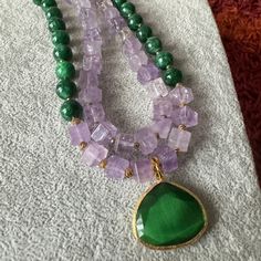 Elevate your style with our Amethyst and Jade Necklace – a unique green gemstone piece crafted for women. This handmade necklace makes a perfect birthday or anniversary gift for your wife,mom,sister or girlfriends. Explore the beauty of beaded jewelry and treat her to a truly special accessory. I use these pieces: - 10 mm jade and amethyst stones,- Small gold color hematite stones,- Cat eyes pendant. -18inches Elegant Handmade Double Strand Crystal Necklaces, Elegant Beaded Necklaces With Stones For Gift, Elegant Handmade Double Strand Crystal Necklace, Elegant Crystal Necklace With Stones For Gift, Elegant Crystal Necklace For Gift, Elegant Crystal Necklaces With Gemstone Accents, Elegant Crystal Necklaces With Gemstone Accents For Healing, Spiritual Crystal Necklaces With Gemstone For Her, Spiritual Crystal Necklace With Gemstone For Her