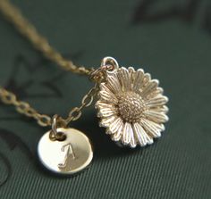 A beautifully intricate and dainty gold plated sunflower pendant hung from a gold plated fine chain. The flower measures 1.2cm (0.5") tall.  You can choose to add the personalisation of a gold plated hand stamped initial tag made with beautiful Calligraphic capital letters from the English language. If you decide that 'no initial required', a tag will not be added to the necklace.  Choose a necklace length tailored to you (please refer to the necklace length guide)  Your necklace will arrive to Yellow Gold Jewelry With Sunflower Design As Gift, Handmade Charming Gold Jewelry, Charming Gold Wedding Jewelry, Gold Flower Jewelry For Anniversary, Gold Flower-shaped Jewelry For Anniversary, Gold Flower Shaped Jewelry For Anniversary, Dainty Sunflower Design Jewelry As Gift, Sunflower Design Jewelry For Anniversary, Elegant Daisy Flower Charm Jewelry