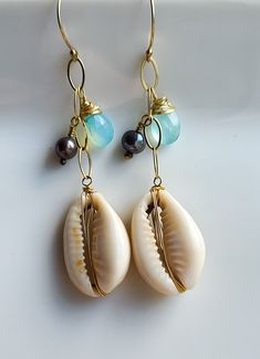 Unique Nickel-free Earrings For Beach, Unique Beach Drop Earrings, Unique Beach Style Drop Earrings, Handmade Cowrie Shell Earrings For Beach, Unique Shell Earrings For Beach, Cowrie Shell Earrings For Beach, Bohemian Shell-shaped Earrings For Vacation, Beach Cowrie Shell-shaped Earrings, Bohemian Shell Jewelry For Pierced Ears