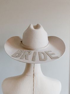 Personalized western bride hat perfect for wedding or bachelorette. Add your own personalized touch we recommend no more than 5 letters if more is needed please message us  Example: BRIDE WIFEY MRS MRS M Sizing: Small: 55cm Medium: 57cm Large: 59cm XL: 61cm please ensure you are purchasing your correct size, hats are not adjustable. Hat details: Our beautiful hats are lined with pink soft satin fabric to ensure your hair remains healthy and undamaged. The color is more of a creamy ivory beautifu Custom Adjustable Wedding Hats, Personalized White Wedding Hat, Personalized Adjustable Hats For Wedding, Customizable White Wedding Hats, Western Bride Hat, Bride Cowboy Hat, Hat For Wedding, Western Bride, Bride Hat