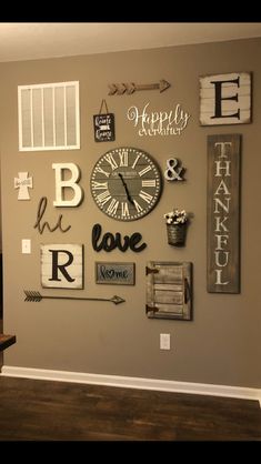 the wall is decorated with many different types of signs and clocks, including one that says happy valentine