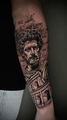 a man's arm with a portrait and some writing on it