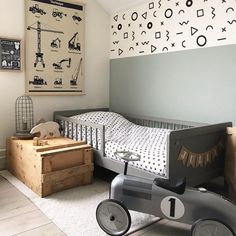 a small child's bedroom with a toy car bed