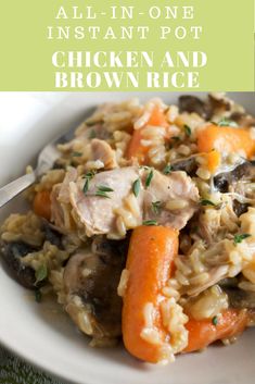 a white bowl filled with rice, carrots and meat on top of a table