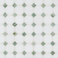 a white and green mosaic tile pattern