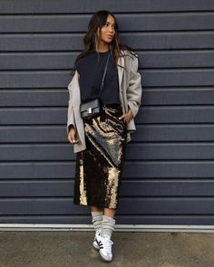 Shine bright this holiday party season with these 21 sparkly sequin skirt outfits, perfect for both casual and dressy looks. ​ ​You'll find gorgeous ideas like this one with a long gold sequin skirt, a black tee, and Adidas Samba sneakers, that'll make you the star of any Christmas or New Year's Eve party. Sequin Skirt Outfits, Sequin Skirt Outfit Casual, White Sequin Skirt, Sequin Skirt Outfit, Sincerly Jules, Sequin Midi Skirt, Midi Skirt Outfit, Sincerely Jules, New Years Eve Outfits