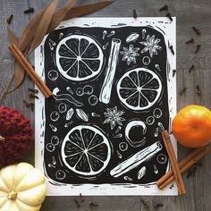 an image of oranges and cinnamon sticks on a table with other autumn decor items