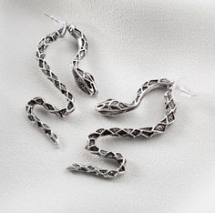 Silver Snake-shaped Earrings, Silver Snake Shape Metal Earrings, Silver Snake Shaped Metal Earrings, Silver Snake-shaped Metal Earrings, Silver Snake-shaped Party Earrings, Silver Snake-shaped Single Earring, Elegant Silver Snake Earrings, Elegant Silver Snake-shaped Earrings, Silver Snake Shape Earrings